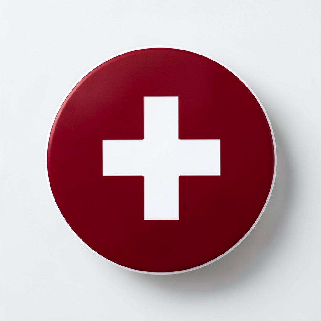 Abstract circular icon representing public health, white cross on deep red background